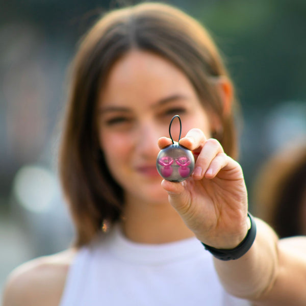 Funda transparente con los tapones para los oídos Mood Earplugs Pro rosa, diseñados para máxima protección auditiva